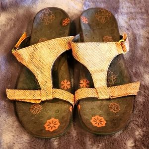 Brown and orange sandals.